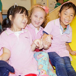 Children smiling together during a school activity